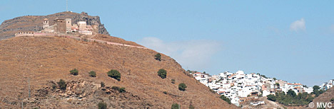 Alora, whitewashed village nestled between three rocky spurs topped by the ruins of a magnificent castle