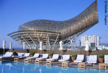 The five star Arts hotel swimming pool and the amazing Frank Gehry fish, two icons of Barcelona. © Michelle Chaplow