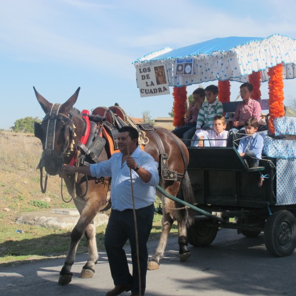 Man with horse cart and kids in the countryside