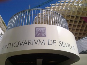 The entrance to the Antiquarium archaeological museum in the basement, with Roman mosaic logo.