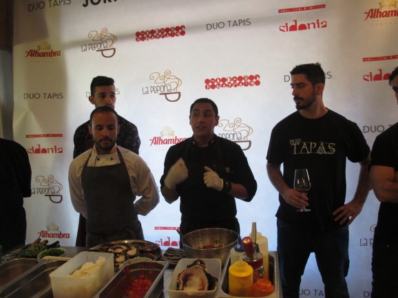 Peruvian chef, Dani Cardenas, of Nazca, with Juan Fortuna of Duo Tapas (right), explains the tapas he's going to create with the fresh tuna and ingredients from his native country.