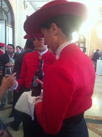 The Tio Pepe girls, in their distinctive garb, dish out the unfiltered sherry to lucky Sevillanos.