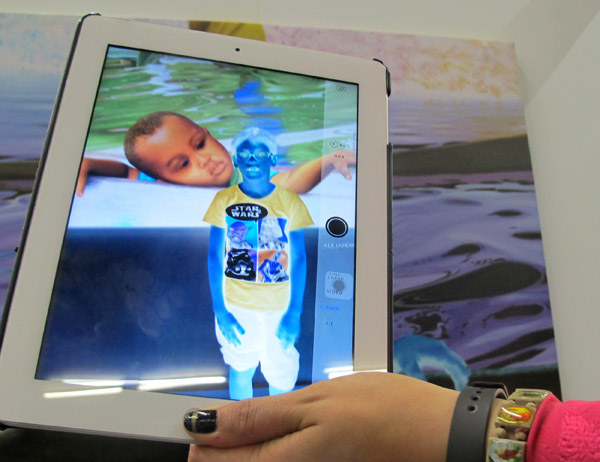 Colombian artist Alejandro Prado used a negative painting technique - here seen through an iPad.