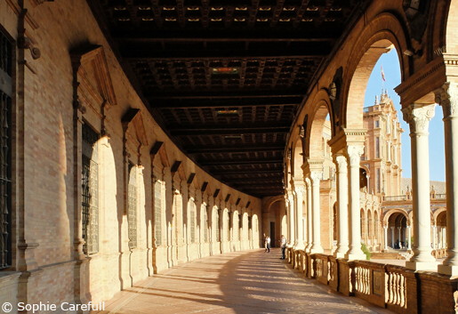 The majestic arches of Plaza de España at sunset. © Sophie Carefull  