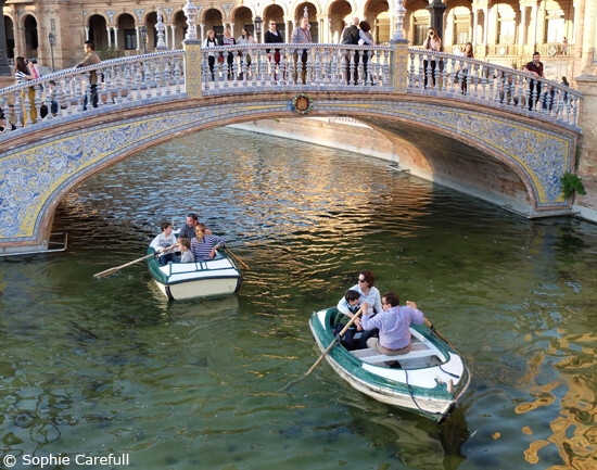 Boats on the canal in the ornately decorated Plaza de Espana. © Sophie Carefull  