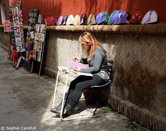 Hand-painting fans in the streets of Seville's old town. © Sophie Carefull  