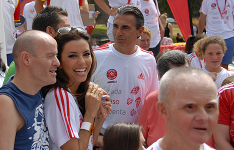 © Rebekah Thompson Seeing where the money goes, Eva meets benificiaries of the Eva Longoria Foundation.