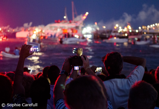 The Virgen del Carmen is taken out to sea on a raft and flares are set off. © Sophie Carefull The
