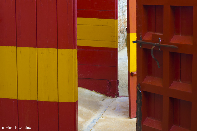The emblematic red and yellow doors of Spain´s bullrings © Michelle Chaplow