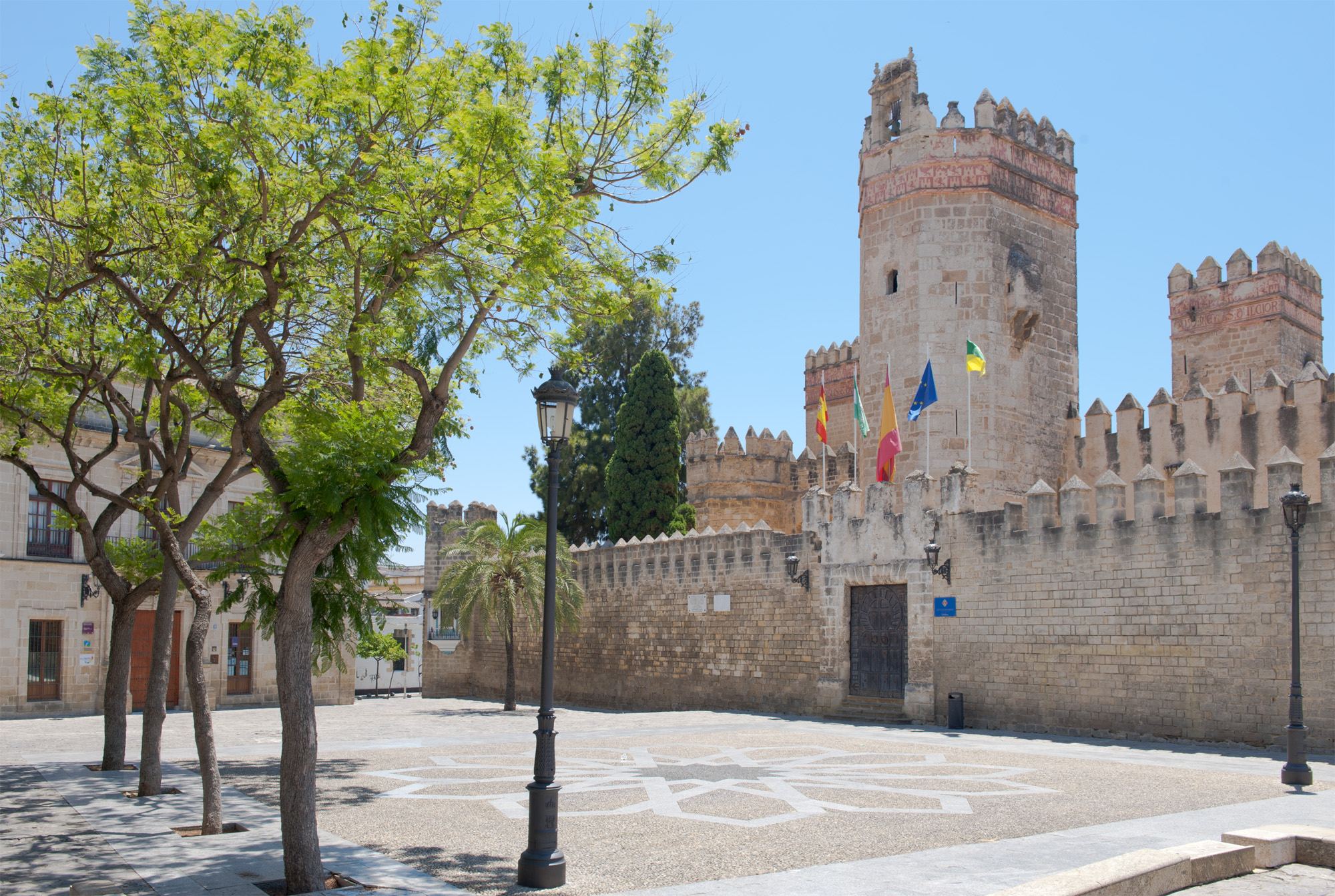 Explore the historic Plaza de Alfonso X El Sabio in El Puerto de Santa María, a charming square surrounded by beautiful architecture, local cafes, and rich local culture © Michelle Chaplow