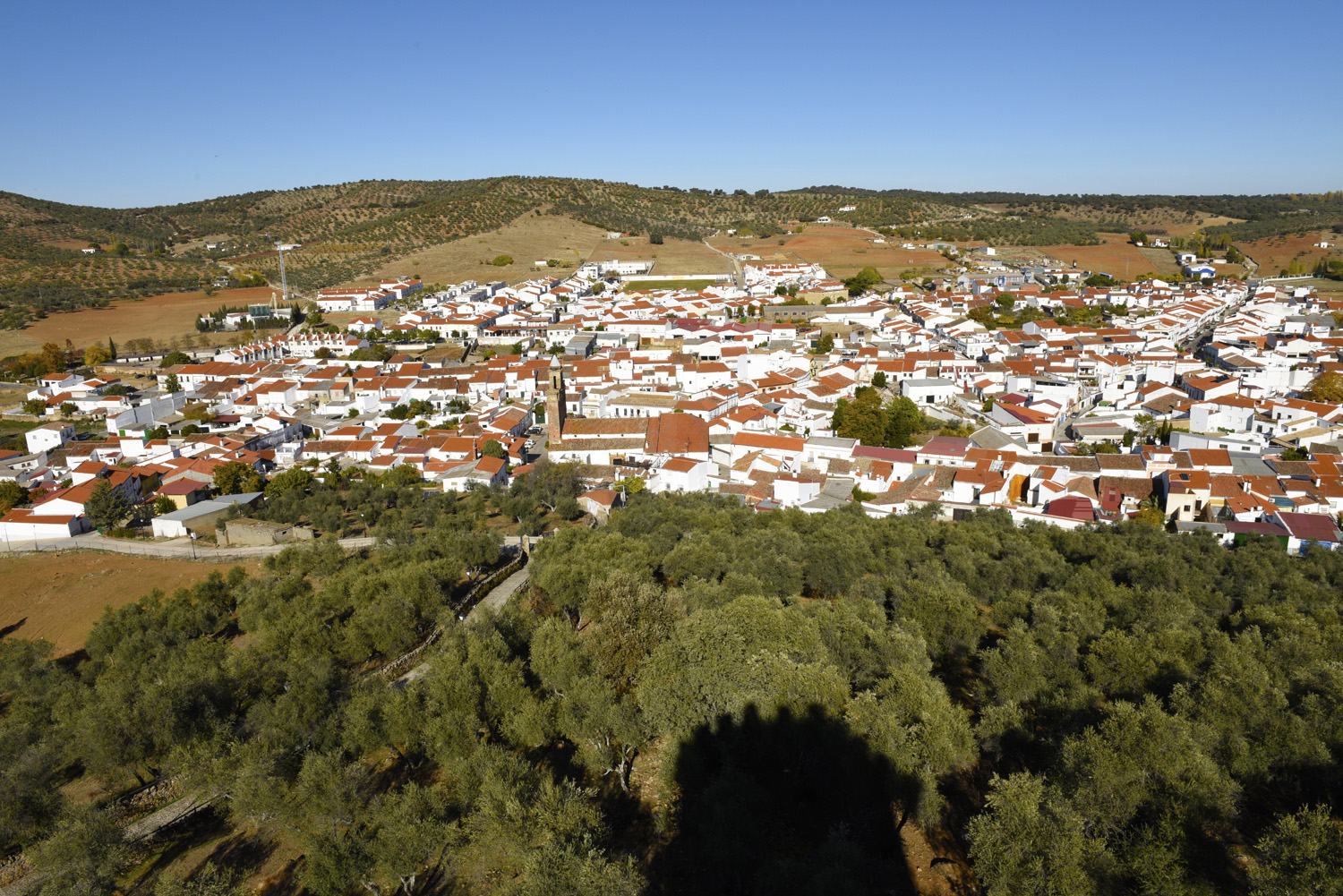 View from the Castle to the village of Alanis, which sits at the foot of the Sierra Norte mountain range. © Michelle Chaplow