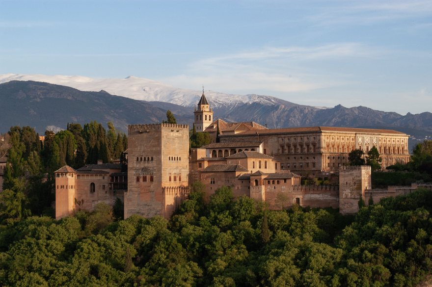 The Alhambra glows warm against the cool, snow-dusted Sierra Nevada — an iconic Granada view that captures the spirit of Andalucía. © Michelle Chaplow