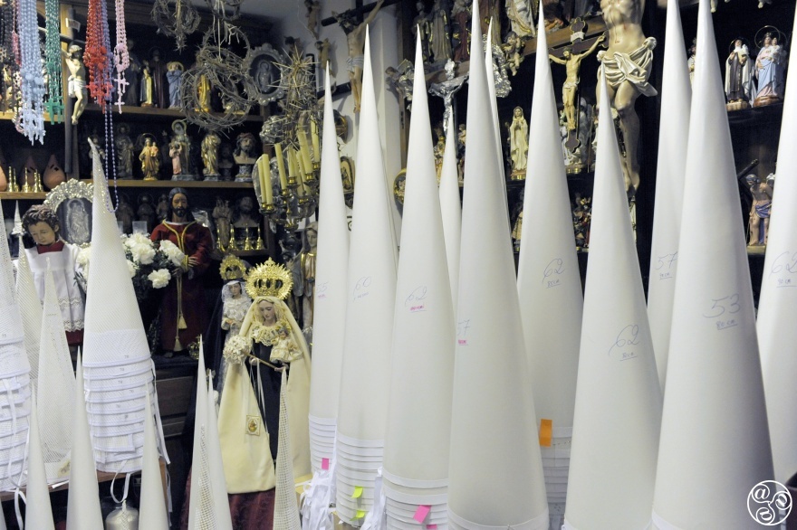 Cone-shaped inner moulds for the tall, pointed headwear of the Nazarenos are stacked in corners, their sizes and heights marked in pencil and tagged with handwritten Post-its—a system charming in its simplicity. Michelle Chaplow