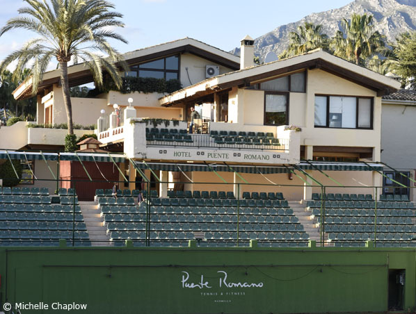 A luxurious tennis court in Puente Romano.