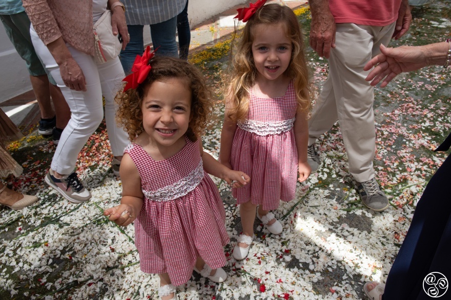 The little children are so excited to be able to walk and play in the petals of the flowers after the procession has gone by. © Michelle Chaplow