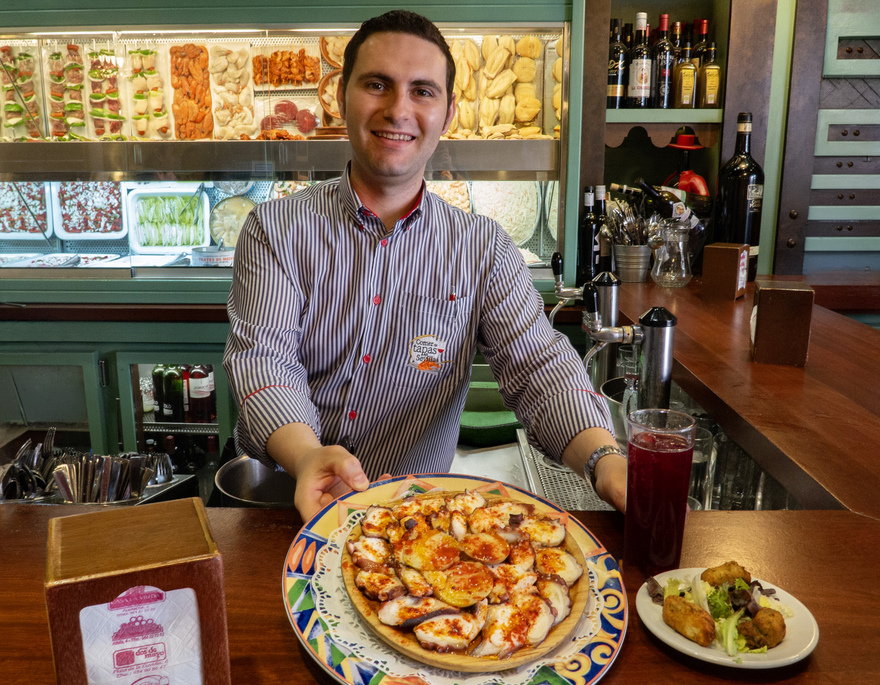 Service with a smile at a Seville tapas bar. © Michelle Chaplow