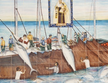 Traditional almadraba tuna fishing depicted on tiles the church in Conil