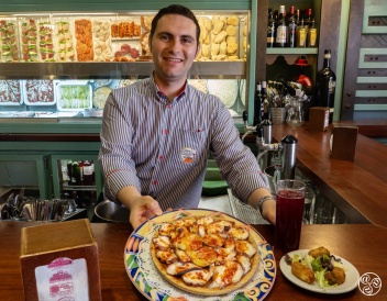 Service with a smile at a Seville tapas bar. © Michelle Chaplow