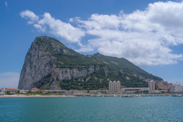 Majestic views of the iconic Rock of Gibraltar towering over the serene, azure waters of the Mediterranean Sea © Michelle Chaplow