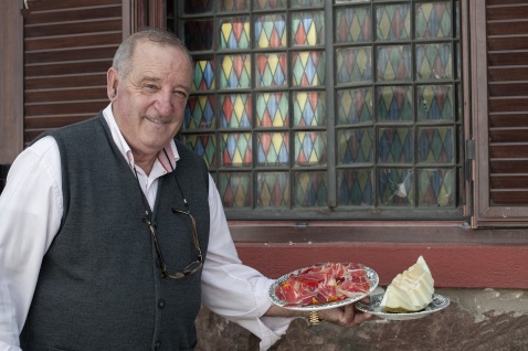  Aracena Restuarante Casas Jabugo, Manuel Romero serving local iberian ham and melon. © Michelle Chaplow