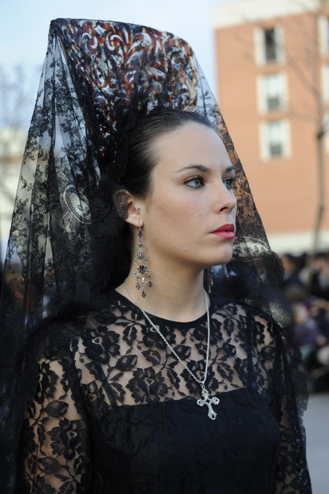 Dressed in a traditional mantilla, a woman takes part in Málaga’s Semana Santa procession © Michelle Chaplow