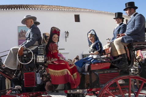 Goya's ladies in a horse drawn carriage, traditionally dressed, wearing ornate dresses and mantillas © Michelle Chaplow