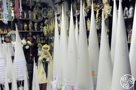 Cone-shaped inner moulds for the tall, pointed headwear of the Nazarenos are stacked in corners, their sizes and heights marked in pencil and tagged with handwritten Post-its—a system charming in its simplicity. Michelle Chaplow