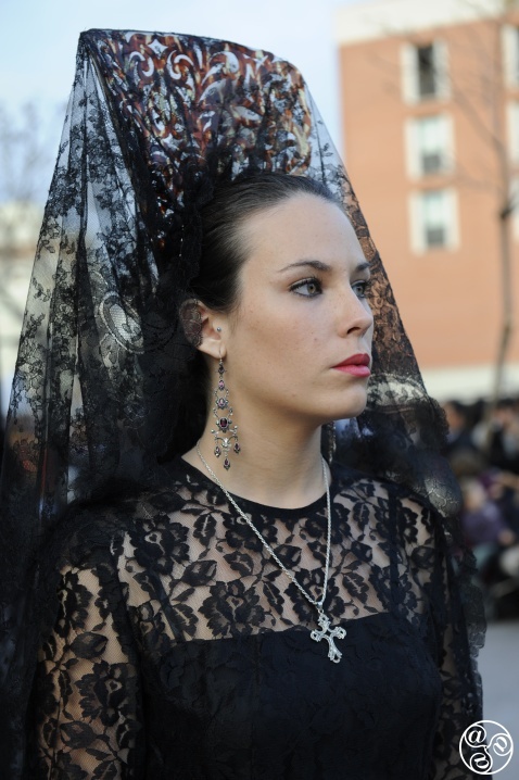 Dressed in a traditional mantilla, a woman takes part in Málaga’s Semana Santa procession © Michelle Chaplow