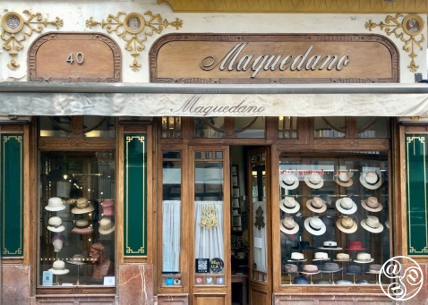 Marble and carved wood frame the historic facade of Maquedano Hat Shop in Seville © Fiona Flores 