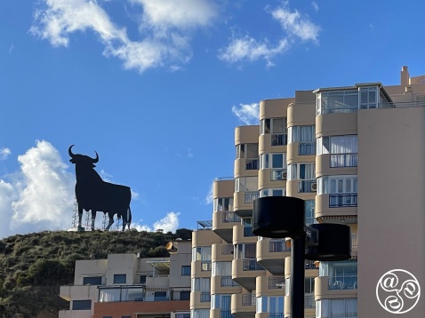 Contemporary architecture with the Osbourne Bull standing around on the hill top in Torreblanca      © Michelle Chaplow