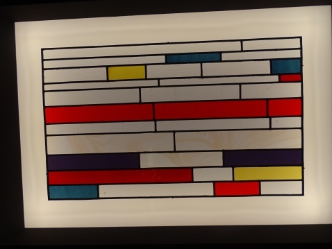 Suspiro de Luz, in a Mondrian-type design of bold colours in rectangles divided by lead strips.  © Fiona Flores-Watson